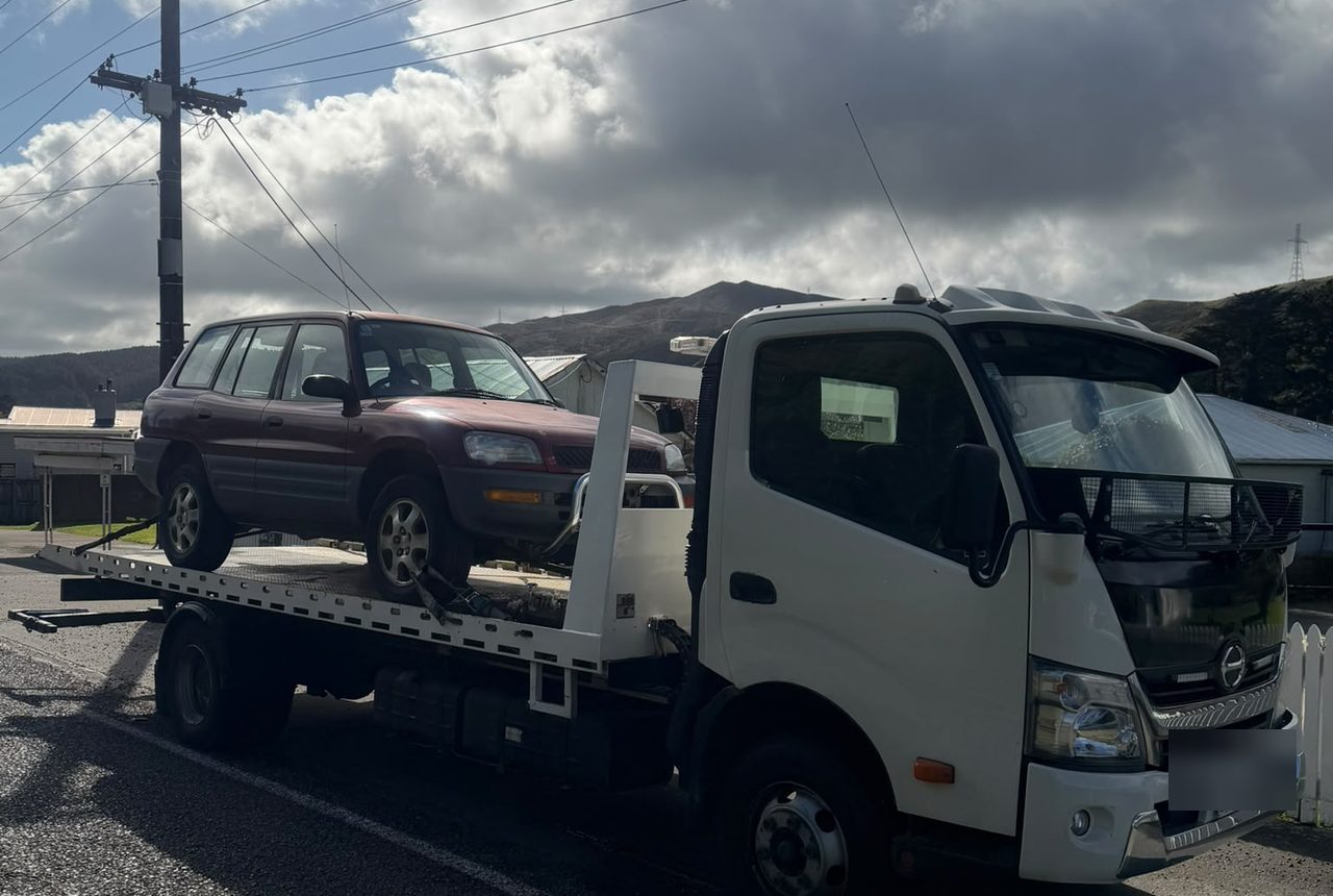 Car Wreckers Rotorua flatbed collecting a Toyota RAV4 across the Bay of Plenty